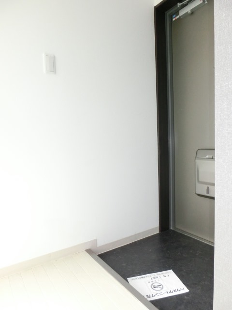 大阪市淀川区十三東３丁目の賃貸マンションの玄関|エアコン