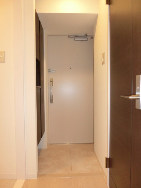 大阪市淀川区十三元今里１丁目の賃貸マンションの玄関