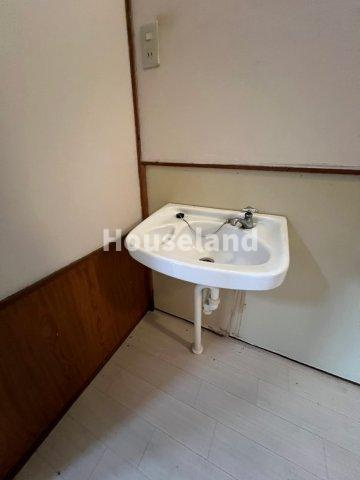 六十谷マンションの洗面所