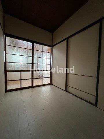 六十谷マンションの洋室