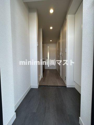 プレサンスDOMECITYコレーレの玄関