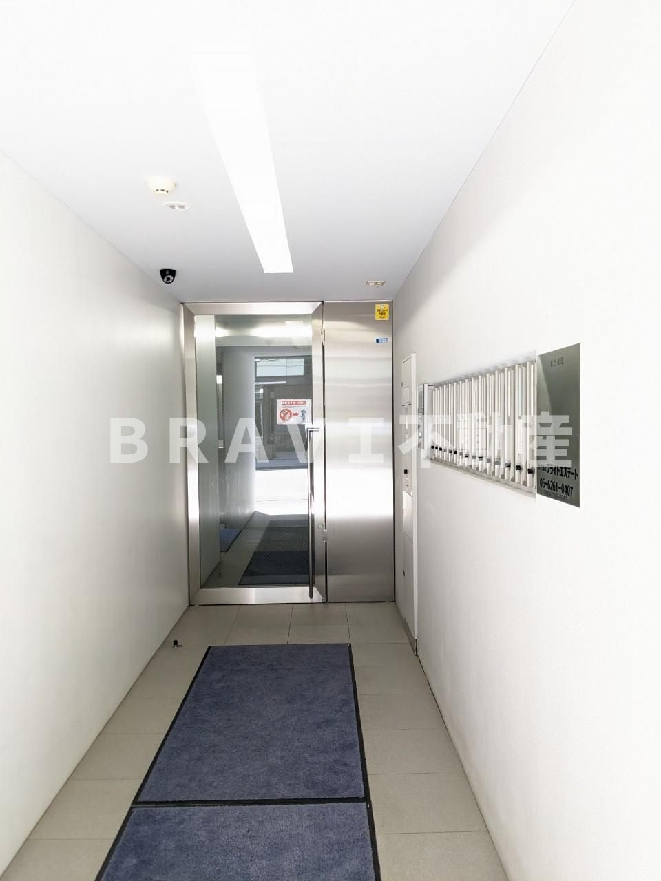 谷四城福ビル BRAVI不動産のエントランス
