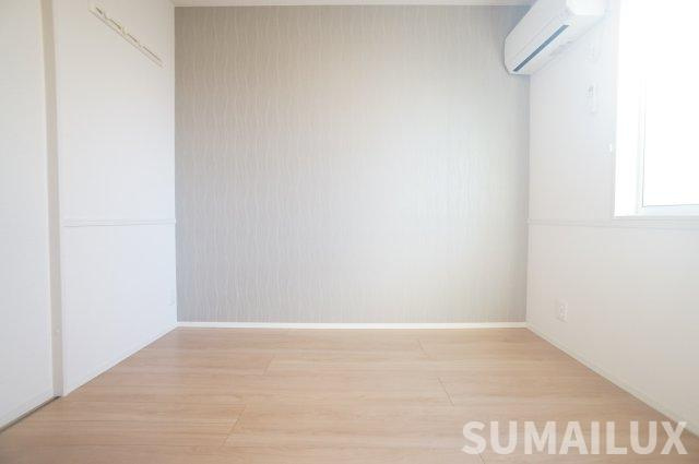 サンライズ新土河原の洋室