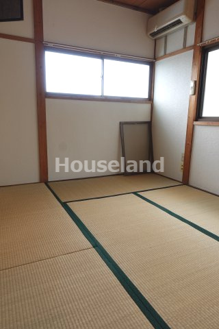 六十谷戸建の寝室