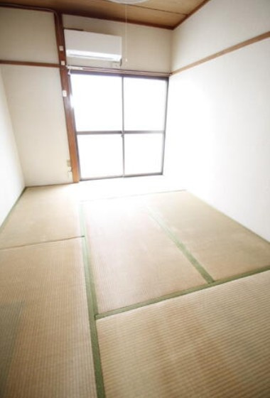 調布市富士見町１丁目のアパートの寝室