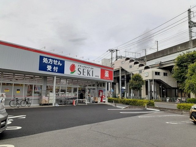 【周辺】 | サニーフラットⅡ | ドラッグストアセキ　沼南店まで1700m