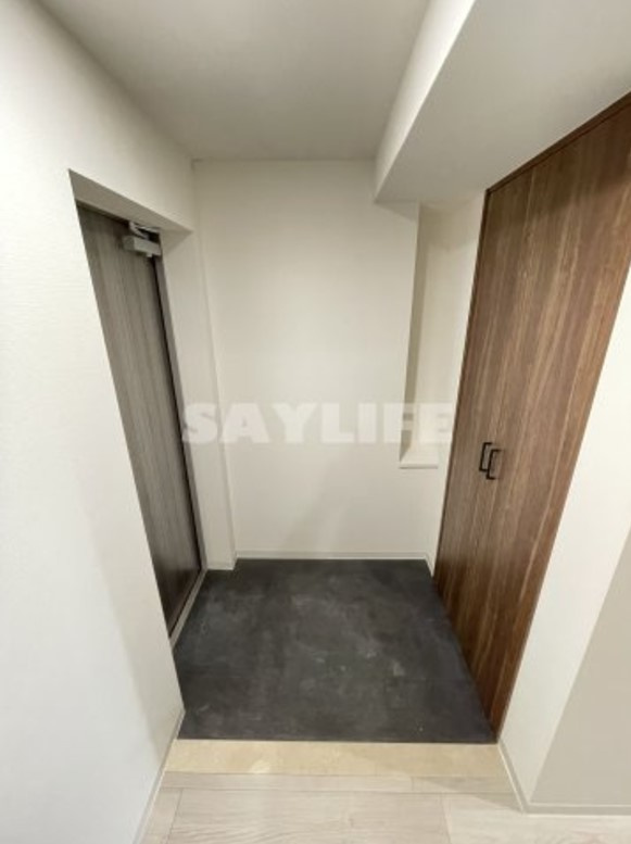 プレサンスＮＥＯ新深江リュミエル の玄関