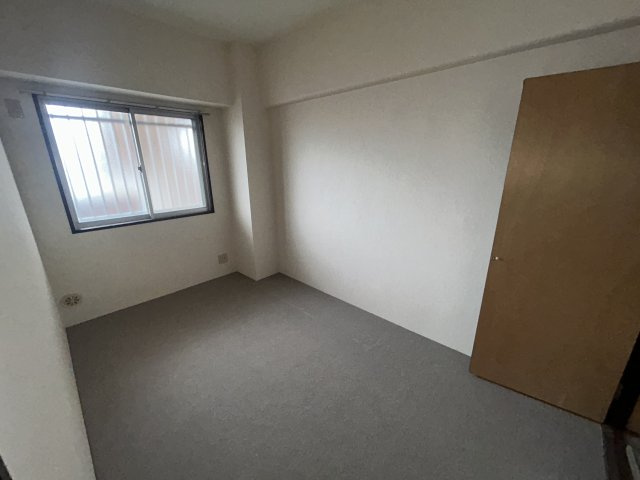 シャルマンフジ岩出参番館の洋室