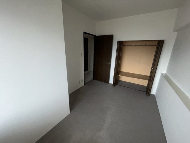 シャルマンフジ岩出参番館の洋室