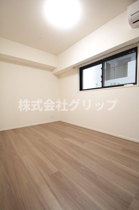 ディームス横濱青木町の洋室