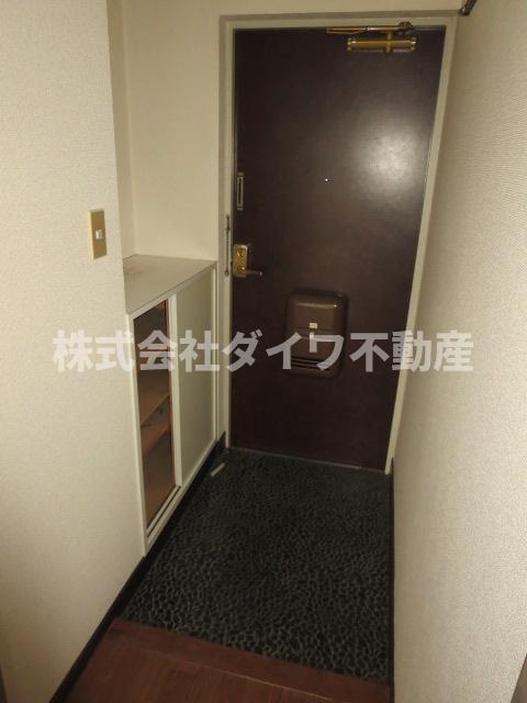 ツトムマンションの玄関