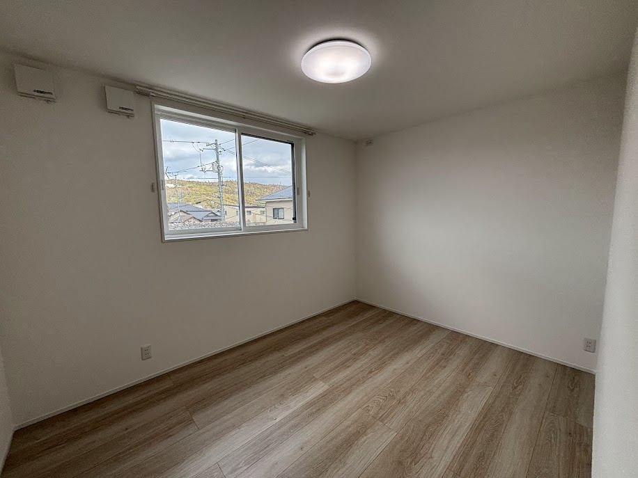 クラハ酒津Ⅲ1号地の洋室
