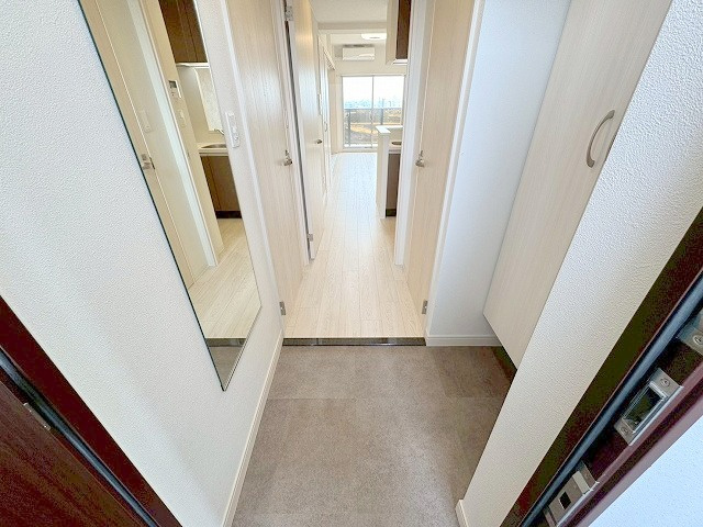 プレサンスNEO上新庄PRIMECRUISの玄関