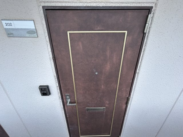 ルミエールSATOHの玄関