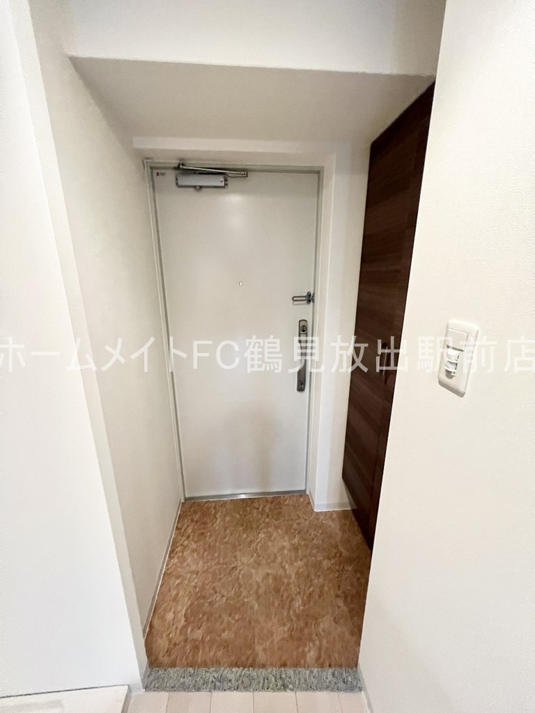大阪市城東区今福東３丁目の賃貸マンションの玄関