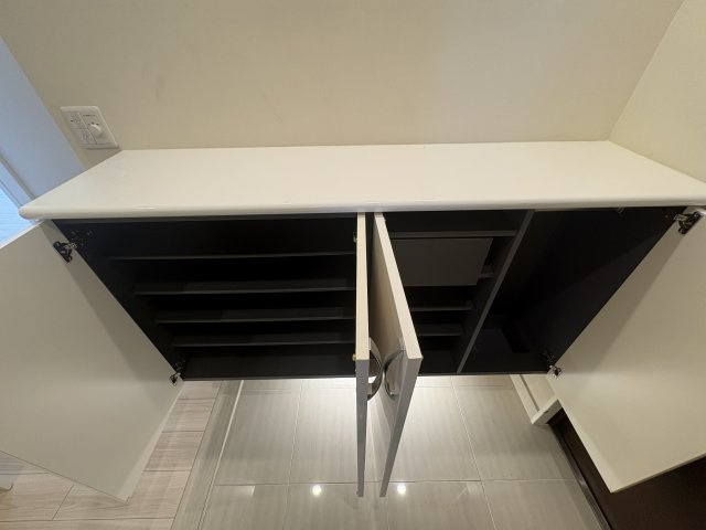 〇ル・サンク旭橋の玄関