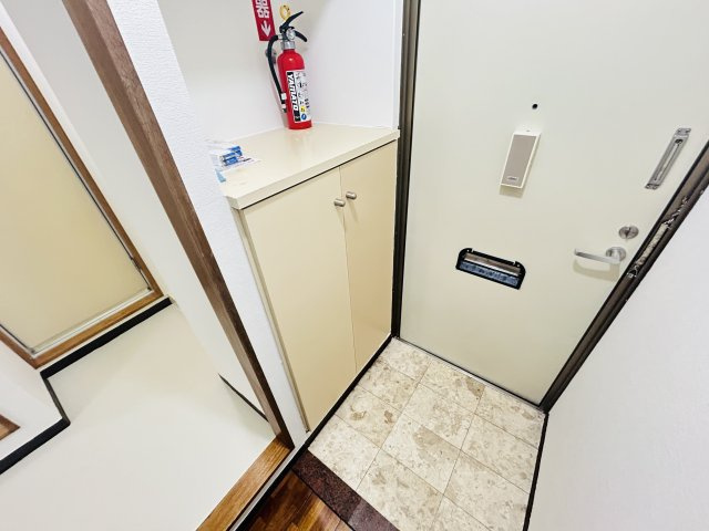 〇ネクスコート旭の玄関