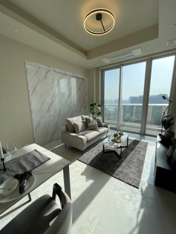 ザ・パークハウス晴海タワーズ ティアロレジデンスの居間・リビング|LDと7帖の間の可動扉を閉めたところ