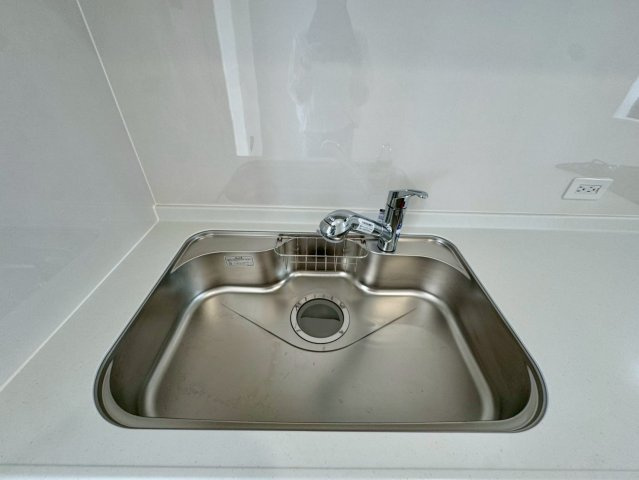 クレイドルガーデン金武町屋嘉 第2・２号棟のキッチン|浄水器付き流し台