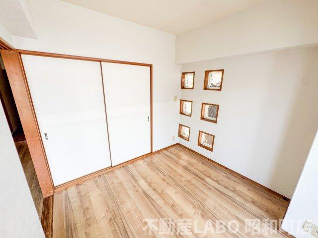  ラウンド東田辺の寝室