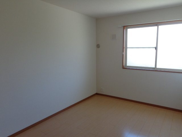 パームヒルズ カネヨシ Ａ棟の洋室