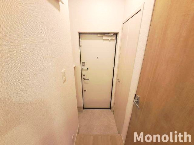 アイマコート初芝の玄関