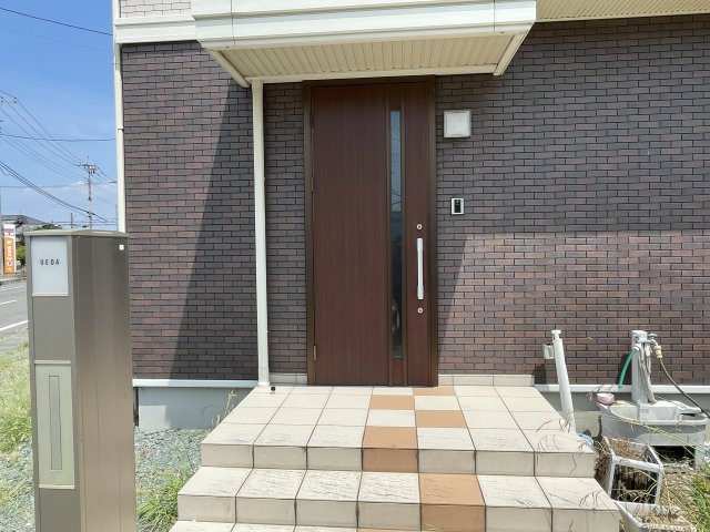 藤岡市本動堂　中古1980の玄関