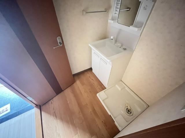 神戸市垂水区名谷町字加市の賃貸マンションの洗面所|洗面