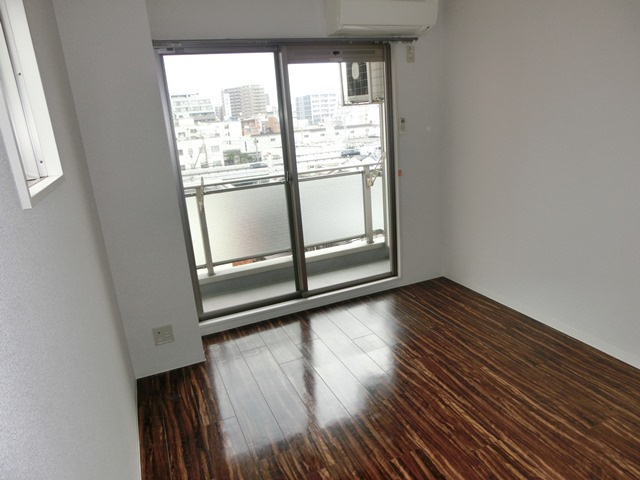 大阪市淀川区十三本町２丁目の賃貸マンションの洋室