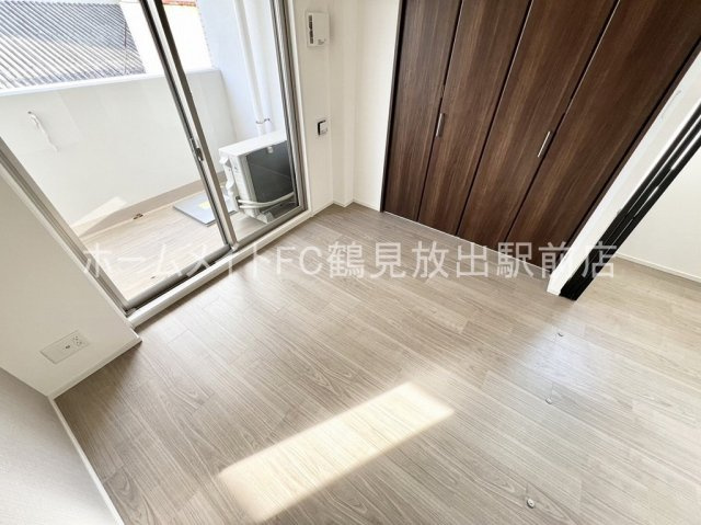 グランカーサ高井田の洋室