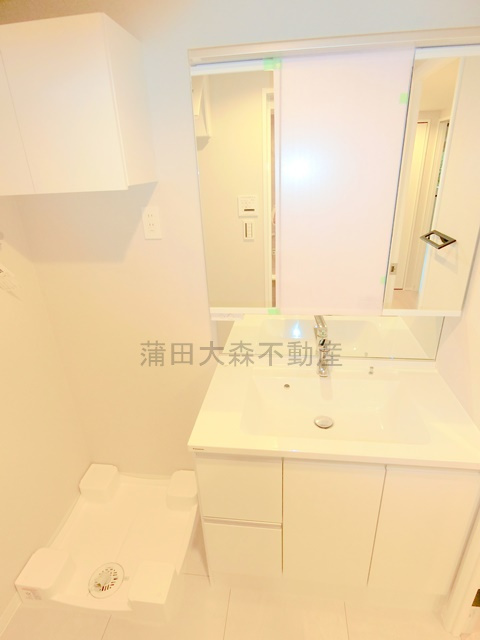 ミリアレジデンス西蒲田の洗面所|独立洗面台と室内洗濯機置き場