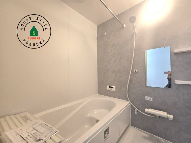 福津市福間南5丁目第6-2棟（1号棟）の内観：施工例|1日の疲れを癒してくれる広々バスルーム。雨の日のお洗濯にも大活躍な浴室乾燥機付です！