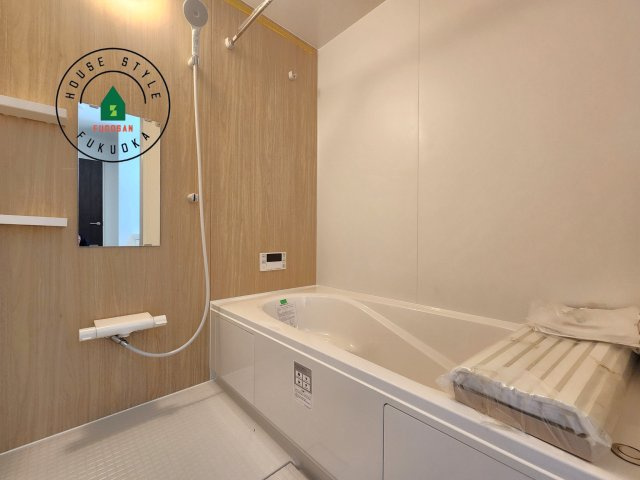 福津市津屋崎1丁目第5-2棟（2号棟）の内観：施工例|1日の疲れを癒してくれる広々バスルーム。雨の日のお洗濯にも大活躍な浴室乾燥機付です！