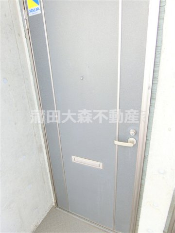 千鳥町ロッソコルサの玄関