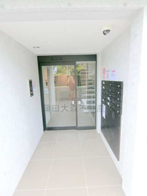 Mind　Kojiya（マインドコウジヤ）のエントランス|オートロックと宅配ボックス付きのエントランス