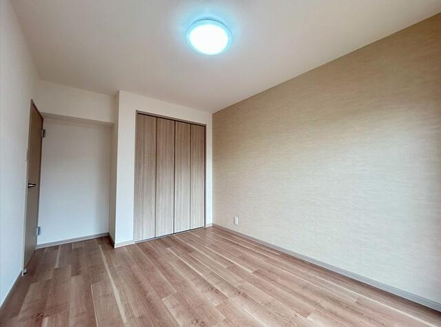 ニューコーポ港楽Ａ棟の洋室