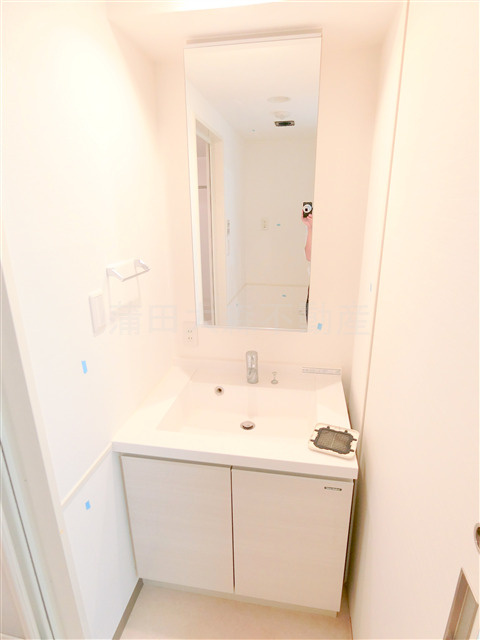 スタイリオ蒲田の洗面所|洗面脱衣所　鏡裏収納の独立洗面台　