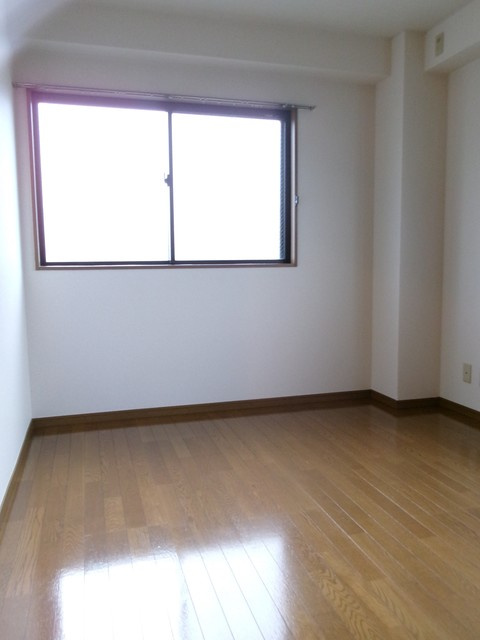 キャピタル高尾の洋室