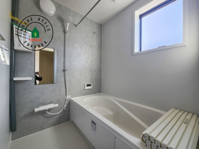 福岡市西区今津第13-1棟（1号棟）の内観：施工例|1日の疲れを癒してくれる広々バスルーム。雨の日のお洗濯にも大活躍な浴室乾燥機付です！