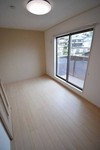 シンティラーレ小松島の寝室