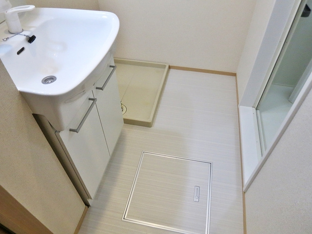 グランフィールドⅢの洗面所|脱衣スペースに室内洗濯機置き場あります