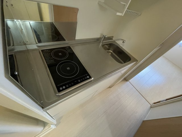稲城市百村のアパートのキッチン