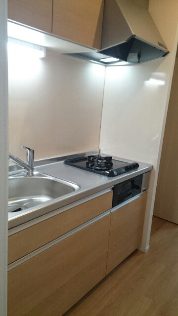 稲城市東長沼のアパートのキッチン