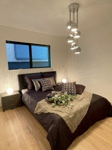 光と風が通う、仁川町の新築プロジェクトの寝室