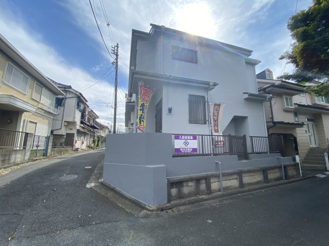 コーポ高橋（賃貸併用住宅）の前面道路含む現地写真