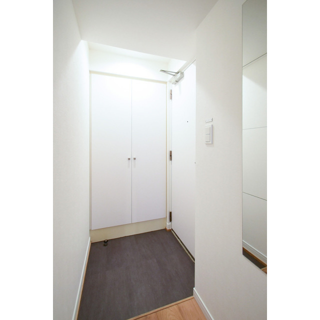 オーパスホームズ三田の玄関