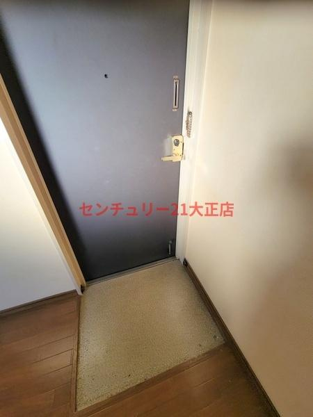 泉尾丸松マンションの玄関