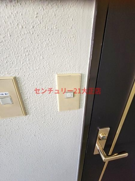 泉尾丸松マンションの玄関