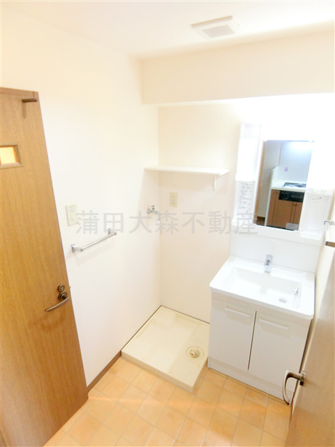 蒲田駅近分譲賃貸マンションの洗面所|独立洗面台　洗濯機置き場　洗面脱衣所