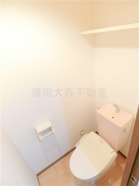 蒲田駅近分譲賃貸マンションのトイレ|トイレ　上部棚あり！